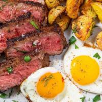 New York Steak and Eggs · New York strip steak served with 2 eggs any style, hashbrowns or breakfast potatoes and toast.