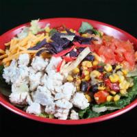 Southwest Salad · All natural chicken, roasted corn, diced tomatoes, cheddar cheese and tri-colored tortilla s...
