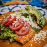 Enchiladas Fundidas de Carne Asada · Grilled skirt steak enchiladas in arbol salsa, melted queso Chihuahua, avocado, romaine, swe...