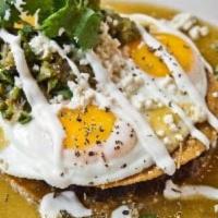 Huevos Rancheros Verdes · 2 eggs atop crisp corn tortillas, black beans, green tomatillo salsas
crema, queso fresco a...