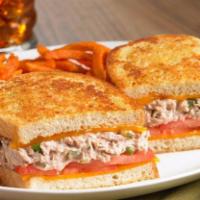 206 Tuna Sandwich · Signature tuna salad, cheddar cheese, and Roma tomatoes on toasted wheat bread.
