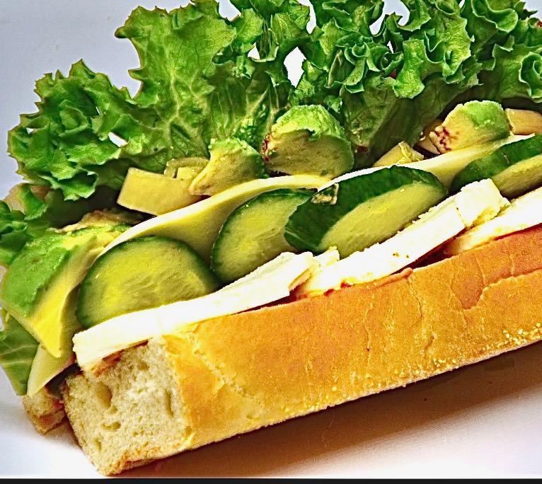Veg Out Sandwich · Avocado. Mozzarella, provolone, pepperoncini, cucumbers, lettuce, tomatoes, and a sun-dried tomato aioli on a sub roll.

