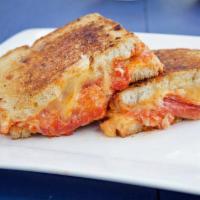 Chicken Pepperoni Panini · Sourdough country bread, Herb-roasted chicken, pepperoni, Parmesan cheese and marinara sauce.