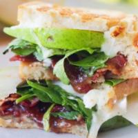 Pear, Bacon, and Brie Panini · Sourdough bread, bacon, brie cheese, pears, jalapeno and fig spread and spinach.