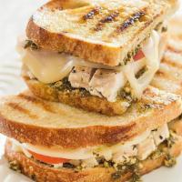 Pomodoro Chicken Panini · Herb-roasted chicken, pesto mayo, provolone, spinach and roasted tomatoes.