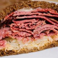 Brooklyn Reuben  · Famous extra-lean corned beef, sauerkraut, imported Swiss cheese, and Russian dressing on to...