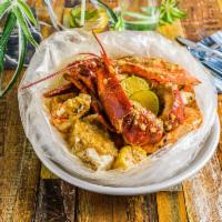 Combo E · king crab leg, Dungeness crab and live Canada lobster. Any seafood with choose 3, corn and p...