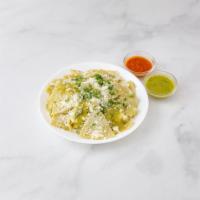 Simples Chilaquile · Includes onions, sour cream and cheese cotija.
