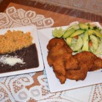 Milanesa de Pollo · Breaded chicken breast. Served with rice, beans, salad and tortillas.