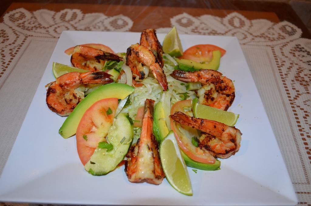 Camarones a la Parrilla · Grilled shrimp with small portion of salad. Served with rice, beans and corn tortillas.
