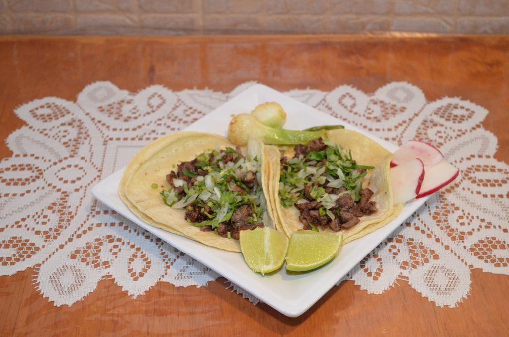 Mexican Tacos · 2 pieces. Cilantro and onions.