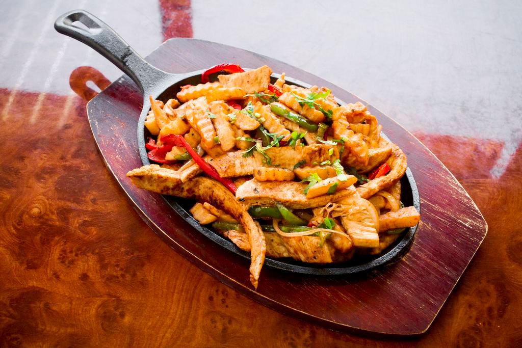 Pollo Salteado · Sauteed grilled chicken strips. Served with your choice of 2 sides.