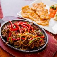 Higado a la Italiana · Sauteed beef liver strips. Served with your choice of 2 sides.