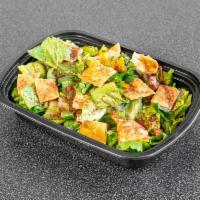 Fattoush Salad · Chopped lettuce, cucumber, tomato, and toasted pita bread with our secret blended dressing.