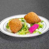 Kebbeh · 2 pieces. Deep-fried cracked wheat dough filled with ground beef.