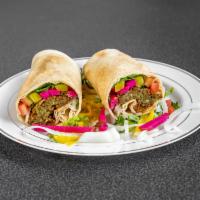 Falafel Wrap · Deep-fried chickpeas rolled with tomato, lettuce, pickle, hummus and tahini sauce wrapped in...