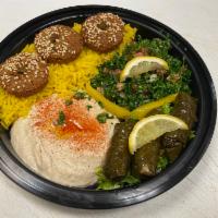 Lounge Vegetarian Combo · 3 grape leaves, 3 pieces falafel, tabouleh, hummus served with basmati rice and fries.