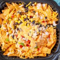 Seafood Nachos · Freshly fried nachos topped with seafood, cheddar sauce, jalapeño peppers, green onions, cra...