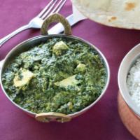 Saag Paneer · (spinach cooked with house made cheese and cream sauce).