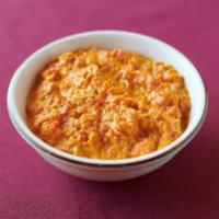 101. Gajar Halwa · Carrot pudding cooked with milk, nuts, raisins and spices. 