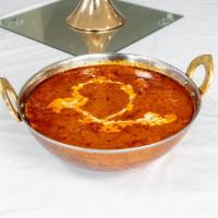 Butter Chicken · Chicken marinated in spices, roasted in a tandoori oven, and cooked in spiced tomato, butter...