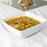 Haleem · A traditional dish made with slow-cooked lentils, wheat, barley, meat, and spice.
