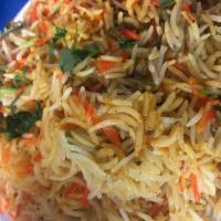 Biryani · Layers of basmati rice and flavorful meat curry cooked with special herbs and spices.