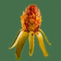 Mango Flower  · Fresh mango designed as a flower, topped with chamoy and tajin.
