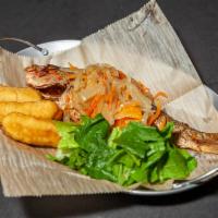 Escovitch Fish Dinner · The famous escovitch snapper, seasoned and pan fried, served with Rice and Peas, Salad and P...