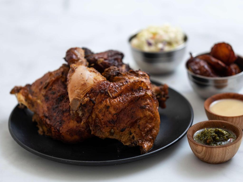 Whole Chicken · With two large sides of your choice, and aji sauces. Marinated free-range rotisserie chicken is slowly roasted over mesquite charcoal open flame.