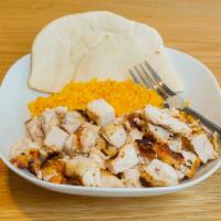 Natural Chop · Chopped grilled chicken breast, served on our special yellow rice, and pita.