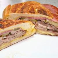 Cuban Sandwich · Ham, pork, Swiss cheese, pickles, and mustard.