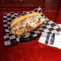 Hillbilly Philly Sandwich · Shaved prime rib, sauteed peppers and onions, provolone and LTO. Served on a toasted sub rol...