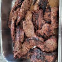 Carne Asada · Grilled sliced steak.