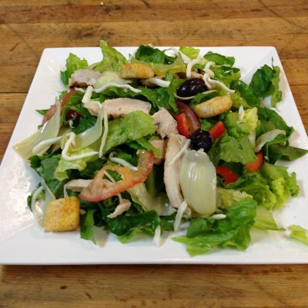 Italian Salad with Chicken · Romaine, pepperoncini, Kalamata olives, artichoke hearts, tomatoes, mozzarella cheese, croutons, chicken and Italian dressing.