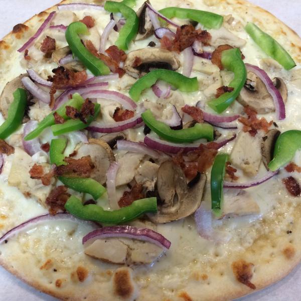 Garlic Chicken and Bacon Pizza · Creamy white sauce and garlic, mozzarella, chicken, bacon, mushrooms, red onions, green bell peppers and tomatoes.