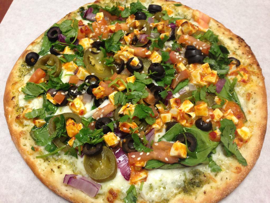 Pesto Paneer Pizza · Homemade pesto sauce, mozzarella, spinach, black olives, jalapenos, red onions, curry paneer, cilantro and green onions.