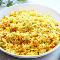 Rice Pilaf · Basmati rice flavored with saffron, coconut, cashews, and raisins.