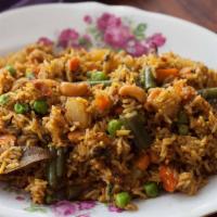 Veggie Biryani · Basmati rice layered with smoked vegetables.