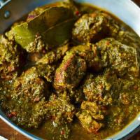 Lamb Saag · Spicy boneless cubes of lamb in puree of spinach and mustard green.