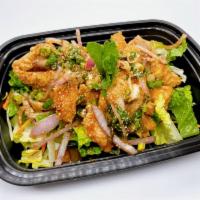 Salmon Nam-Tok  · Fried salmon chunks, red onions, green onions, cilantro, mint leaves, toasted rice powder in...