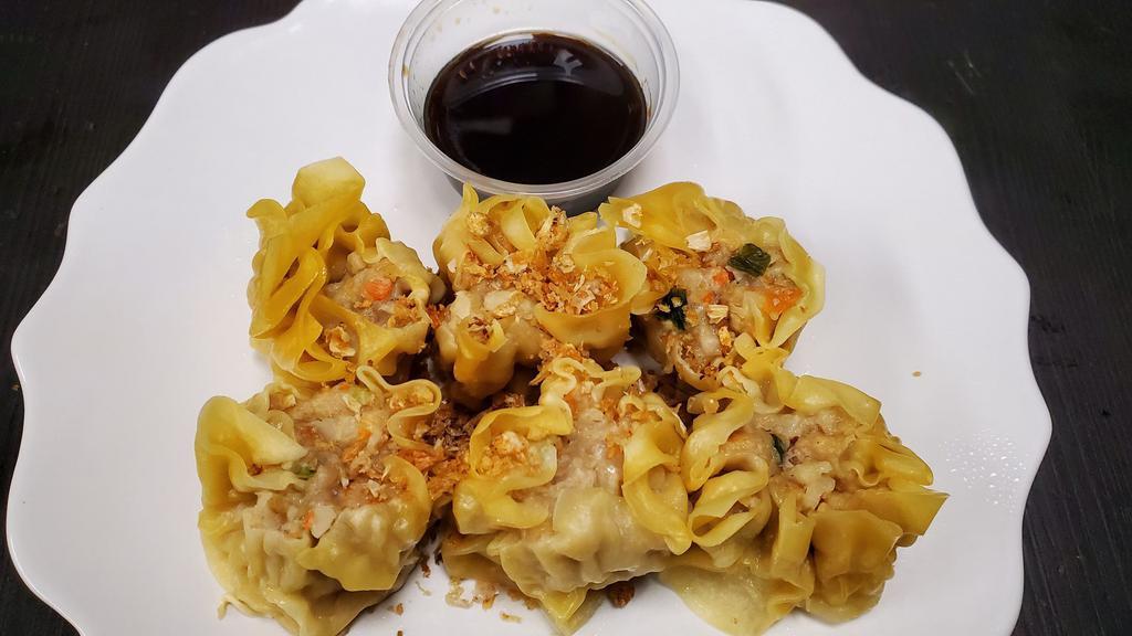 Steamed Dumpling (5pcs)  · Ground pork, bamboo and dried black mushroom steamed dumpling topped with fried garlic.  Served with a homemade soy sauce.