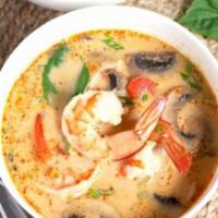 Lemon Grass Soup (Tom Yum) · Thai classic spicy lemongrass soup and mushrooms topped with cilantro and green onions.