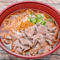 Pho Beef Noodle Soup (Pho Naue) · Boiled, sliced flank steak, rice noodles, and bean sprouts in a spicy beef broth soup topped...