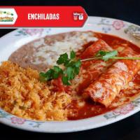 Enchilada de Espinacas · Rolled corn tortilla stuffed with fresh spinach sauteed with tomato and onion, topped with c...