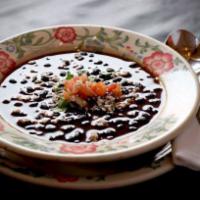 Whole Black Bean Soup · Whole black bean soup, served in its own broth, finished with diced tomatoes, onions, cilant...