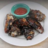 Jerk Chicken Wings · Seasoned with a variety of hot spices.