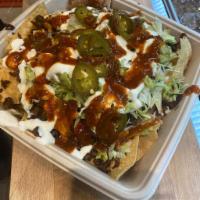 Super Nacho · Choice of meat, beans, lettuce, guacamole, sour cream, cheese, jalapeno, salsa.