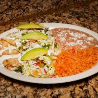 Flautas · Lettuce, tomato, avocado and sour cream.