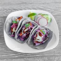 4. Baja Tacos · 3 fresh tacos filled with beer battered fish, coleslaw, cilantro and a house Mexican cream s...